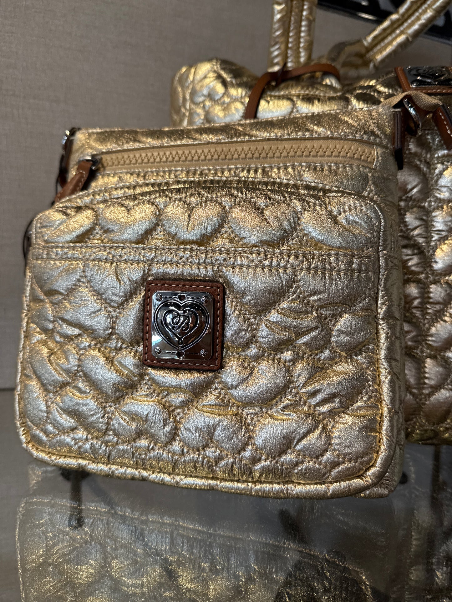 Gold Kallista messenger bag