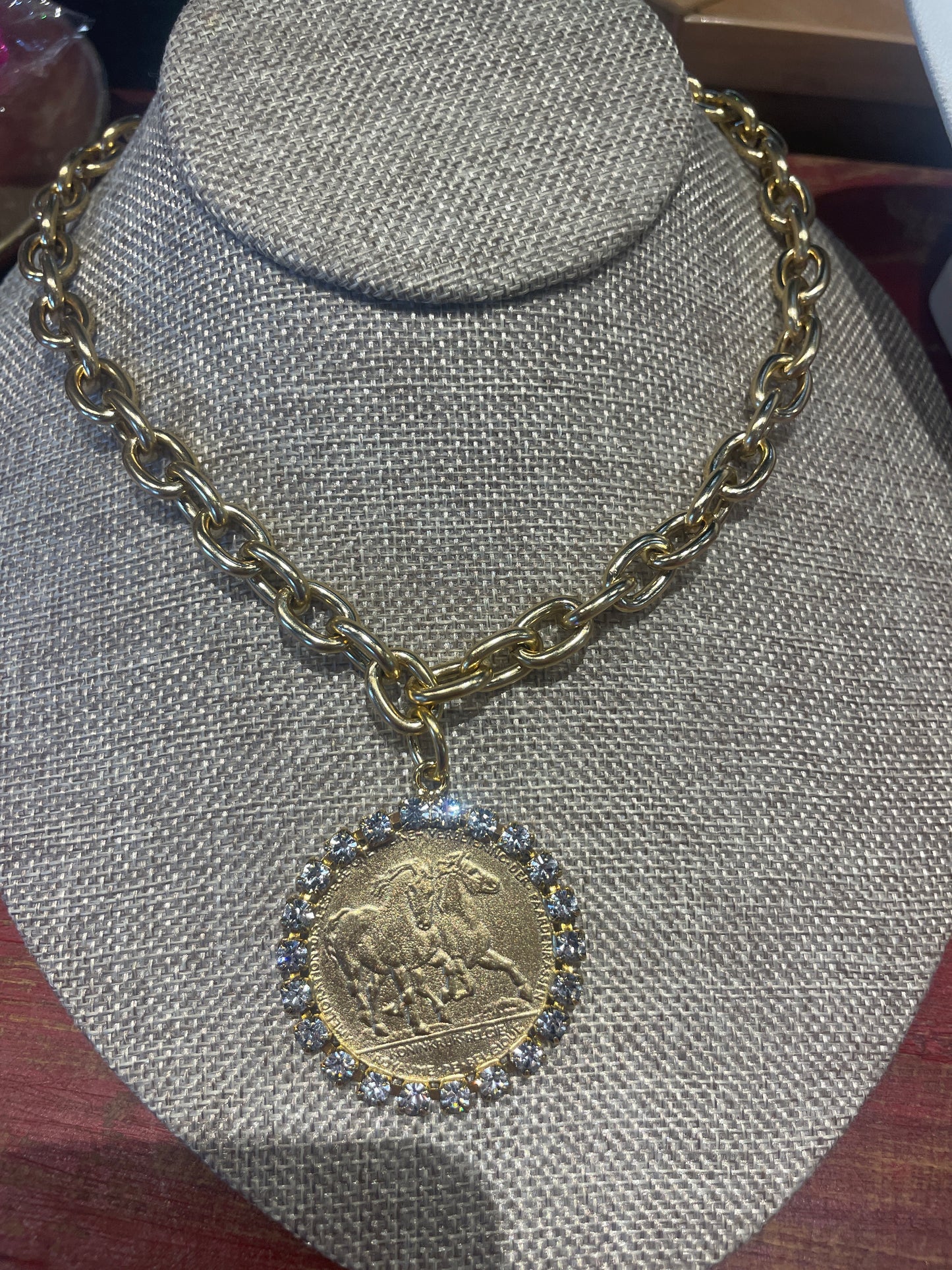 coin necklace with diamonds around