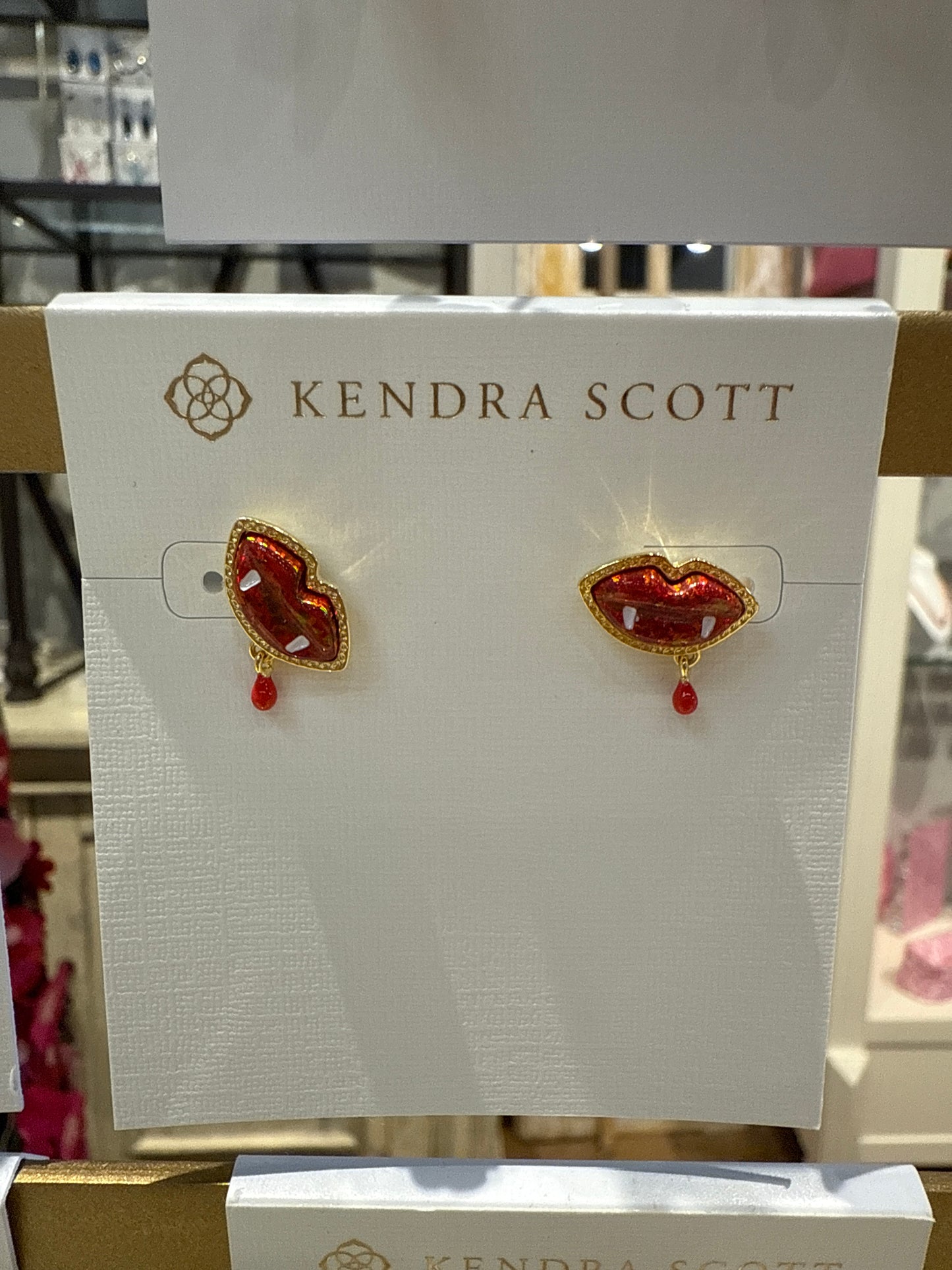 Gold vampire stud earrings