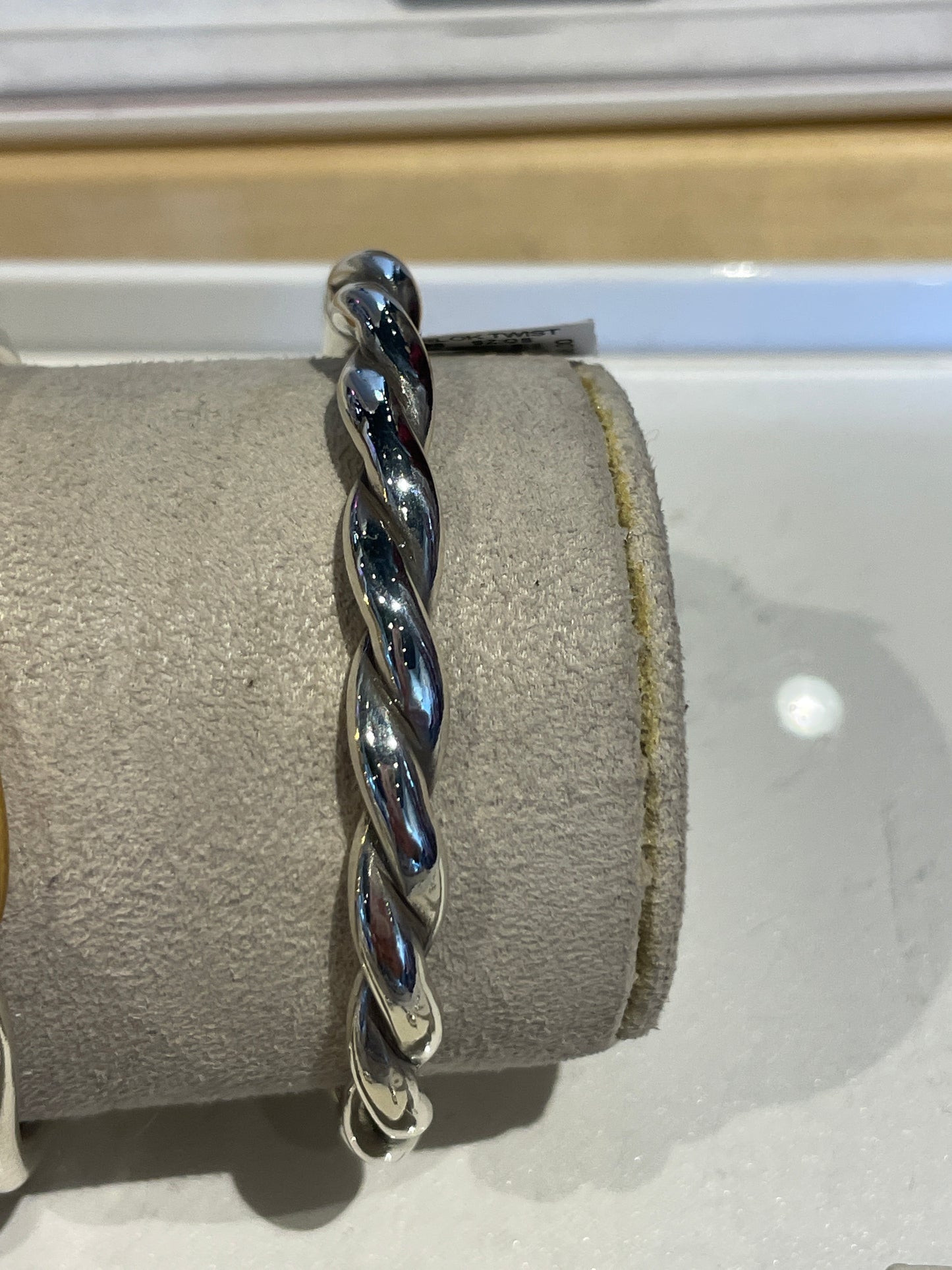 INTERLOCK TWIST HINGED BANGLE