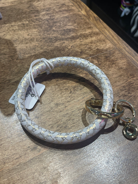 white & gold key ring