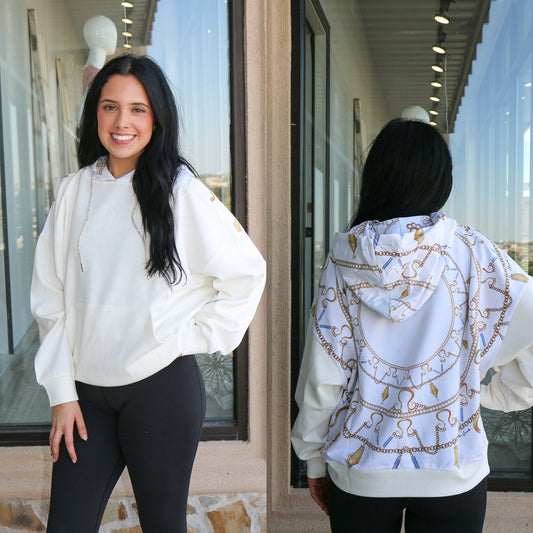 white hoodie with gold chain detail